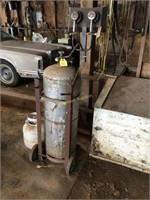 LP tank and portable heater on cart