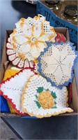 Lot of potholders with needlework and crocheting