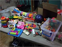 group of toys and tote