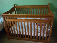 wooden crib and bedding