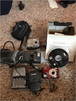 2 digital cameras, battery charger and film camera