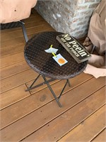 OUTDOOR  WICKER TABLE AND WOOD SIGN
