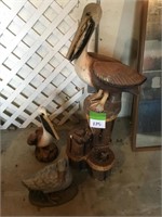 Cement Pelicans, duck and log stand