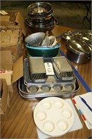 lot of graters, pans and plastic bowls,