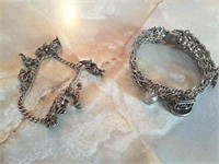 2 Sterling bracelets with charms 46.8 G