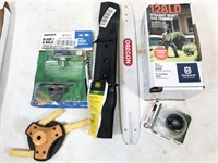 assorted lawn mower/trimmer/chainsaw parts. May