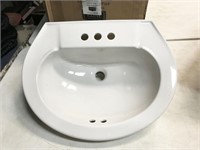 porcelain pedestal sink, believed to be display