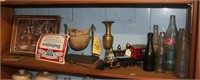 shelf with coke bottles