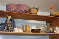 shelf of fish bowls and basketts