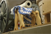 2 baby quilt racks with afghan