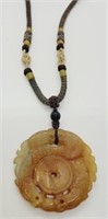 Carved Jade Pendant on woven necklace