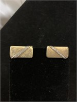 Pair of 14 karat gold and diamond cufflinks.