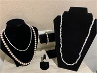 Selection of ladies pearl jewelry. Peach color