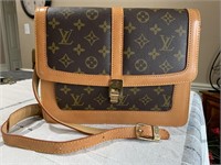 Louis Vuitton shoulder bag, shows little wear on