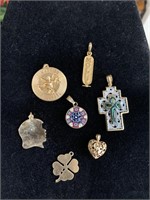 10 K and 14 K charms and pendants. The cross is a