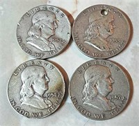 Four Franklin half dollars-some with damage