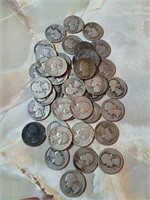 Forty Washington silver quarters