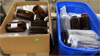 2 Boxes of Amber Colored Glass Bottles with lids
