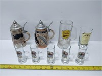 lot of beer steins, mugs, shot glasses, etc.