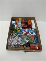lot of assorted toys - smurfs, toy vehicles, etc.