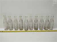 10 vintage coke bottles
