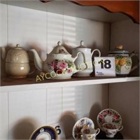 Shelf full of tea pots (4)