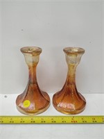 Pair of marigold carnival glass candlesticks