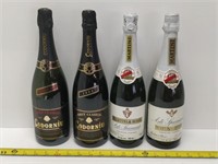 4 collectable wine bottles, never opened
