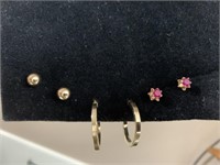 Three pair of gold earrings. Gold ball post studs