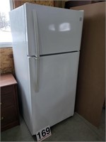 Refrigerator  works / clean / dent on bottom back