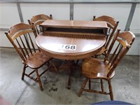 42" round table w/ 2 leaves & 4 chairs