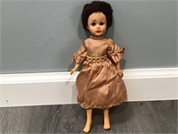 ANTIQUE DOLL WITH SILK DRESS AND BEADS