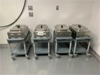 Four AdCraft Warmers with Lids & Inserts on Carts