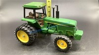 JOHN DEERE TRACTOR WITH CAB AND REAR DUALS