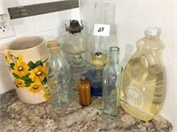 crock pitcher, oil lamps & vintage bottles