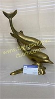 Brass dolphin statue