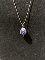 Blue Lapis Lazuli world globe necklace. Google