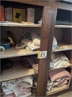 Towels and contents of cabinet bottom