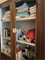 Towels and contents of cabinet