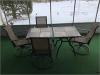 Two patio tables and four rocking chair