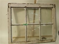 Wood framed window, glass pane broken