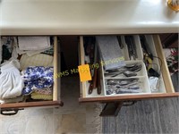 Cabinet contents - silverware, knives, glass pitch