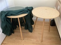 Pair of round wood tables with glass tops