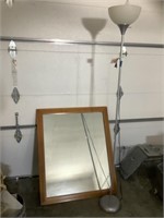 Wood framed mirror and floor lamp