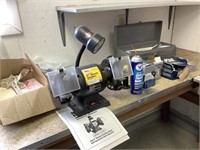 Bench grinder and table contents