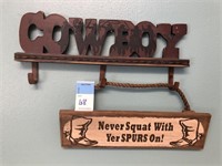 Cowboy hooks, wood sign