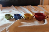 Ceramic measuring cups in primary colors