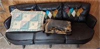 Faux leather couch with fishing weighters and
