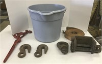 Bucket with chain hooks and chain puller