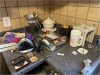 Everything on Top of Counter Left of Sink